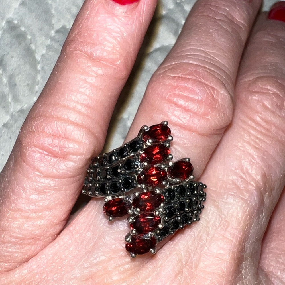 Red and black stones in a 925 Sterling Silver ring